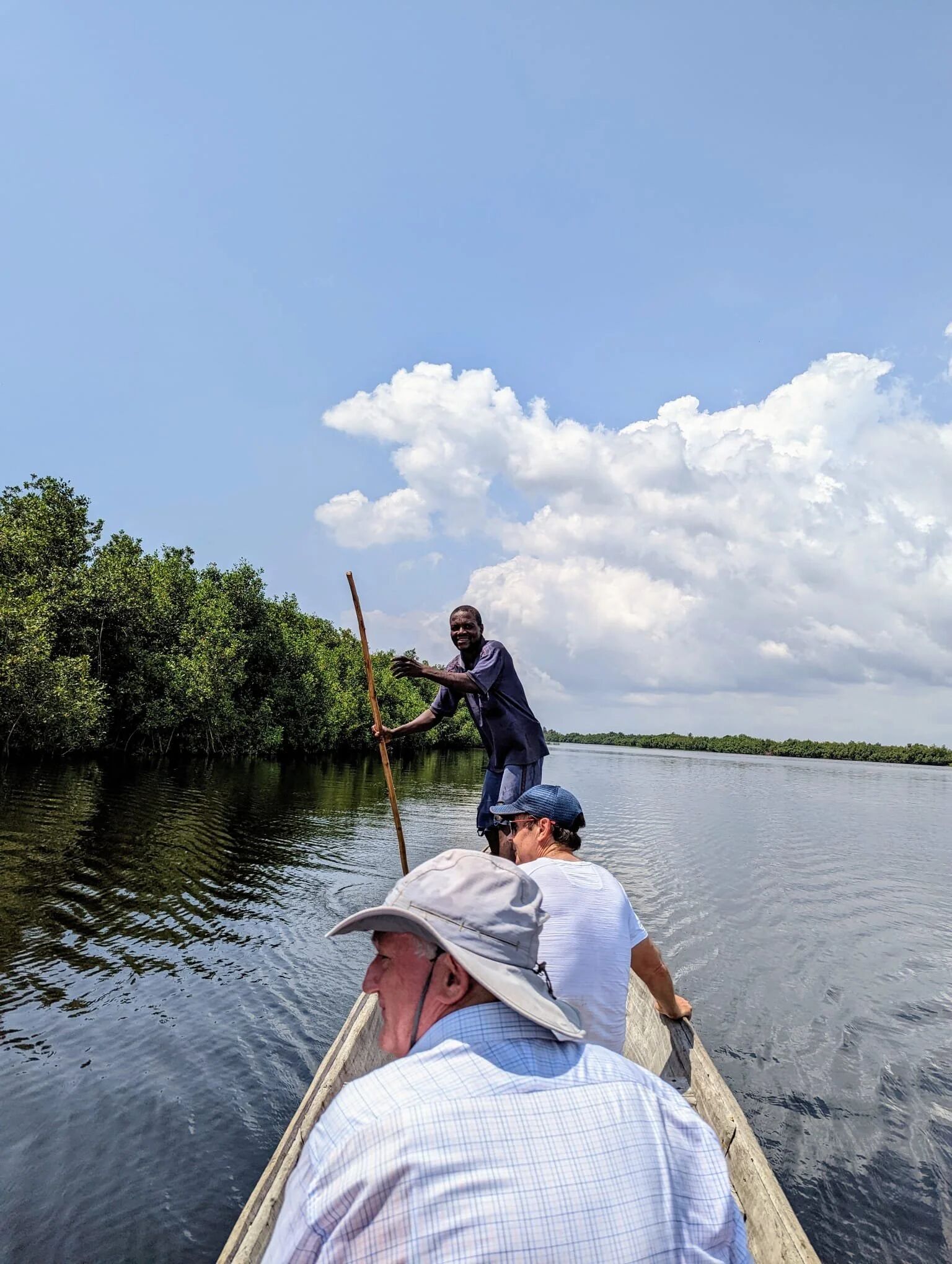 Travelling by canoe across a coastal lake in Benin